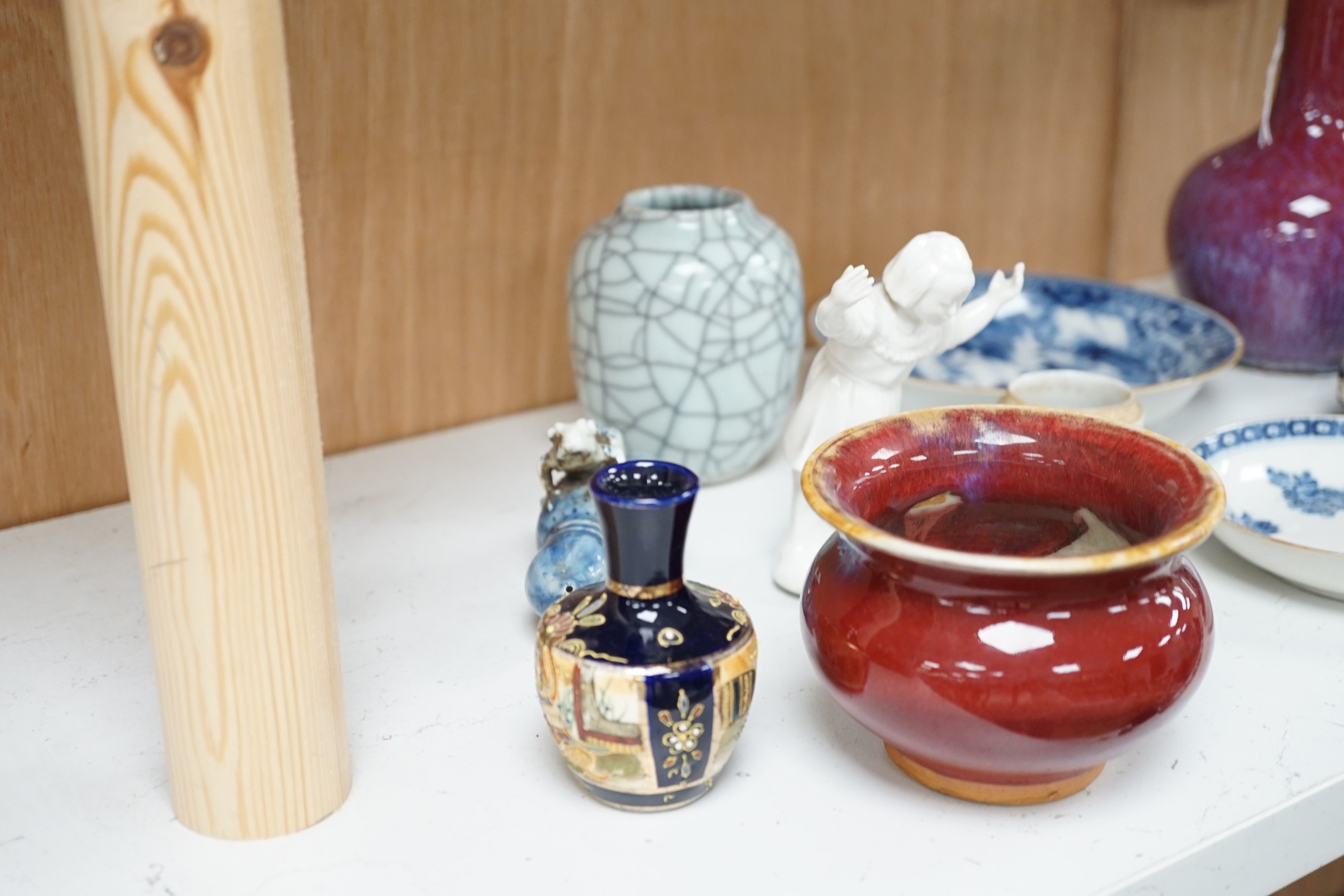 A group of Chinese and Japanese ceramics. Tallest 18cm